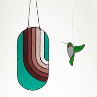Geometric striped panel and hummingbird ornament hanging