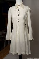 Full front view of white cotton dress on mannequin