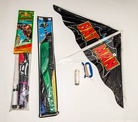 All three kites: packaged Power Rangers, packaged Rainbow Sparkler, assembled Batman with handle and spool