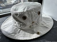 Full view of white Tilley T3 hat showing brim and eyelets