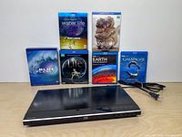 Player, six documentary Blu-ray cases and power cord