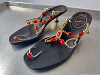 Full view of both sandals showing overall design and embellishments