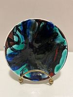 Front view of Poole Delphis dish showing abstract glaze