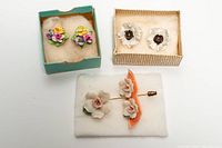 All three earring pairs and stick pin in boxes