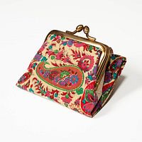 Wallet front profile showing paisley floral fabric and gold-tone frame
