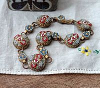 Full view of micro-mosaic bracelet showing all seven floral links and clasp
