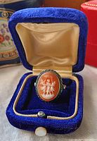 Ring in open blue velvet box front view