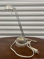Full view of translucent desk lamp showing overall design and power cord
