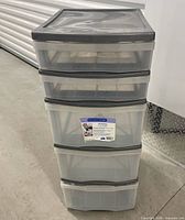 Front view of five-drawer plastic storage unit