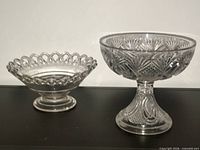 Both pressed glass compotes side by side