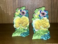Front view of both floral ceramic bookends
