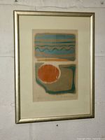 Full view of framed abstract print on wall