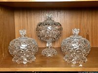 All three Moon & Star covered dishes on shelf