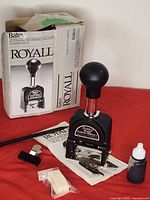 Numbering machine with accessories and box