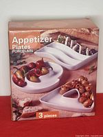 Front of boxed set showing three appetizer plates