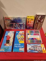 Front view of all boxed art supplies laid out