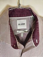 Close-up of label inside collar showing Ben Sherman branding, slim fit tag, check pattern and color