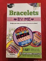Front of SpiceBox Bracelets By Me kit box showing product name and sample bracelets