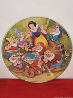 Side A showing Snow White with Seven Dwarfs around wash tub