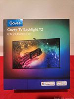 Retail box front showing model name and TV size range