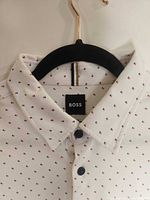 Collar and BOSS label on white micro-dot shirt