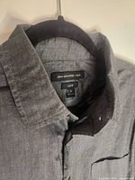 Label showing John Varvatos USA Luxe, size M