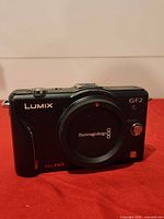 Front view of Panasonic Lumix GF2 body with Blackmagicdesign body cap