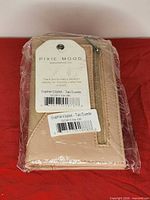 Wallet in original plastic with tag showing brand and model