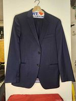 Front view of navy suit jacket on hanger