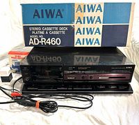 Cassette deck front view with box, RCA cable, power cord