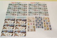 Group shot showing all charity stamp sheets and seals in lot