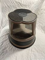 Overall view of brown Kero-Step cylindrical stool showing top, interior step, and exterior bumper