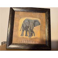 Front view of framed elephant wall picture