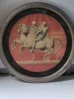 Front view of round neoclassical reverse printed mirrored plaque