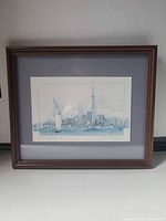 Front view of framed, matted lithograph