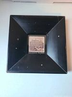 Full view of square black frame with center photograph