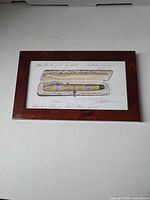 Full view of framed print showing illustration, frame and scale