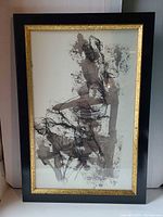 Full view of framed painting showing artwork, frame, and glass