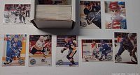 Open box of cards with nine sample cards laid out, showing player fronts and Pro Set Platinum logo