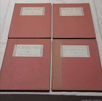 Front covers of all four folio volumes