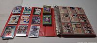 Binder open showing Bo Jackson cards in sleeves and surrounding card arrangement