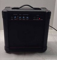 Front view of AK15G combo amplifier powered on