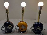 Front view of three CFL helmet lamps lit