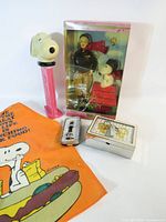Group shot showing all five Snoopy and Barbie items
