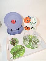 All items: tray, plates, glasses, place card holders