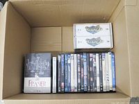Overview of boxed DVDs inside cardboard carton