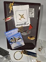 Front view of board displaying multiple aviation pins and de Havilland keychain