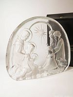 Front view of Mats Jonasson crystal nativity sculpture with case