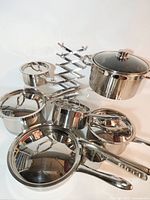 Full view of Lagostina cookware set with lids, trivet and accessories