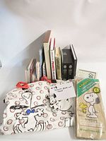 Group shot of tote, books, sealed lunch sacks and ephemera
